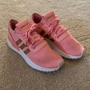 Pink and gold Adidas athletic shoes